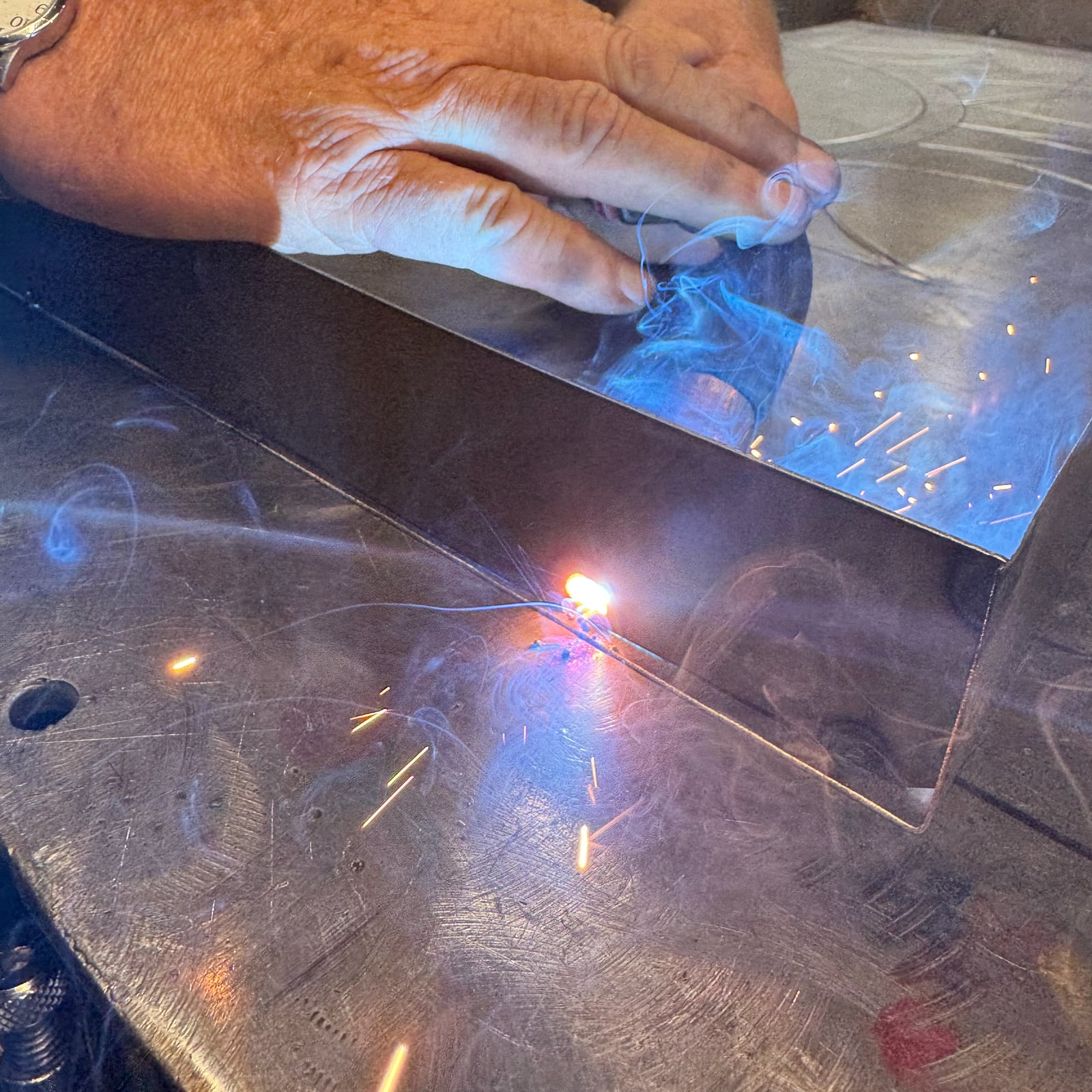 Welding a formed metal piece